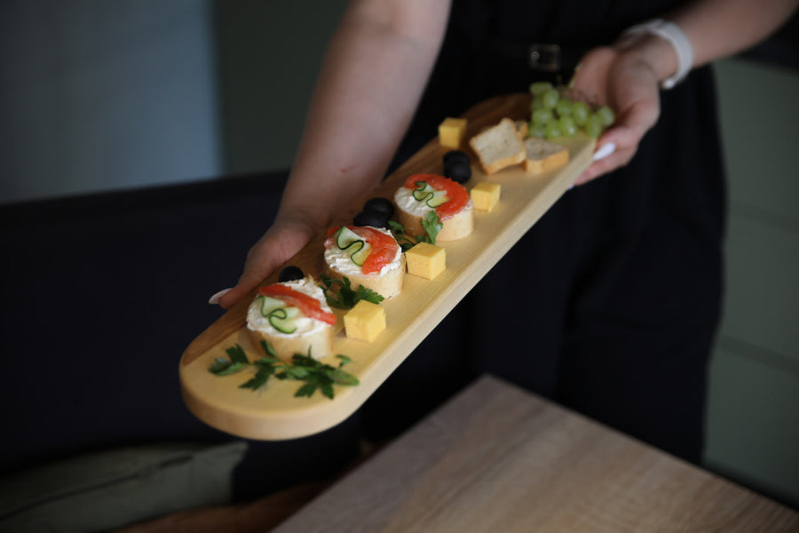 Elegant wooden serving board made from high-quality ash and oak. Perfect for serving cheese, charcuterie, or appetizers. Durable, stylish, and ideal for any kitchen or dining setting