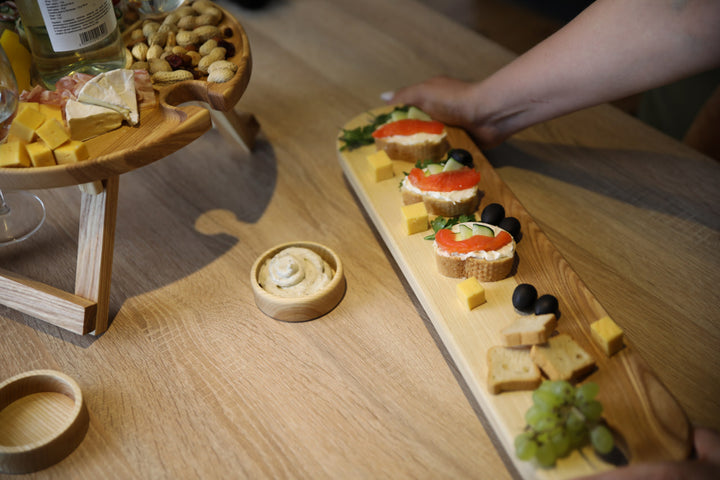 Elegant wooden serving board made from high-quality ash and oak. Perfect for serving cheese, charcuterie, or appetizers. Durable, stylish, and ideal for any kitchen or dining setting