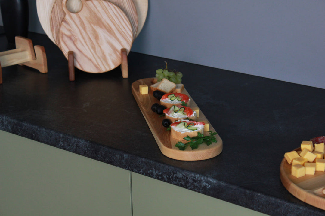 Elegant wooden serving board made from high-quality ash and oak. Perfect for serving cheese, charcuterie, or appetizers. Durable, stylish, and ideal for any kitchen or dining setting