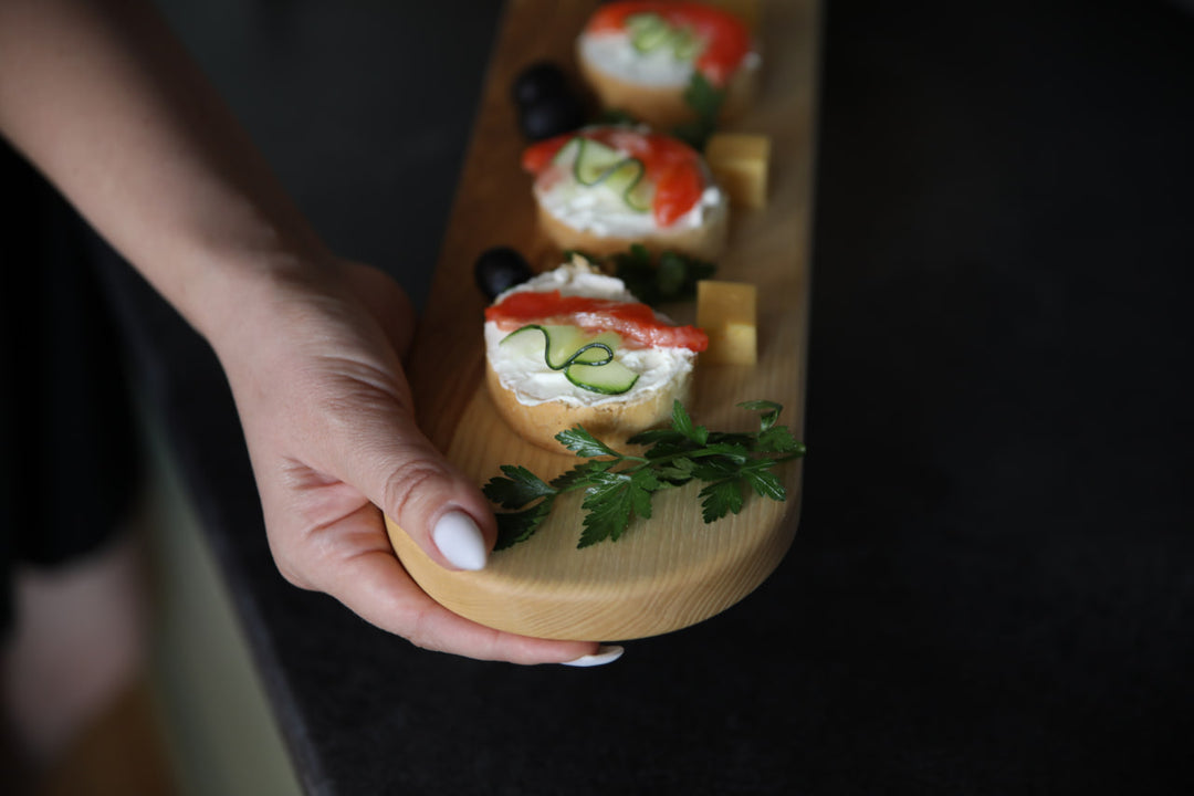 Elegant wooden serving board made from high-quality ash and oak. Perfect for serving cheese, charcuterie, or appetizers. Durable, stylish, and ideal for any kitchen or dining setting