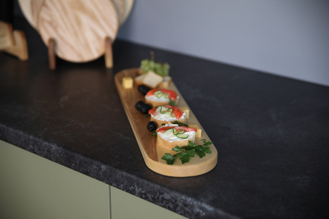 Elegant wooden serving board made from high-quality ash and oak. Perfect for serving cheese, charcuterie, or appetizers. Durable, stylish, and ideal for any kitchen or dining setting