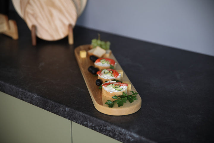 Elegant wooden serving board made from high-quality ash and oak. Perfect for serving cheese, charcuterie, or appetizers. Durable, stylish, and ideal for any kitchen or dining setting