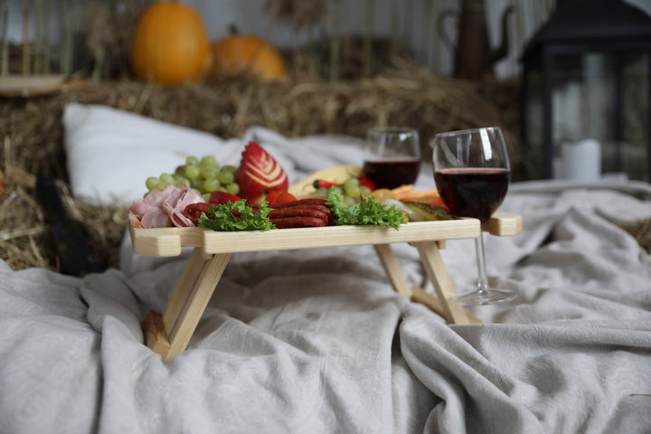 Wine-and-cheese-picnic-table-made-of-wood