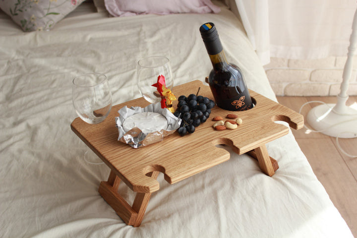 Outdoor-wine-table-with-slots-for-glasses-and-bottle