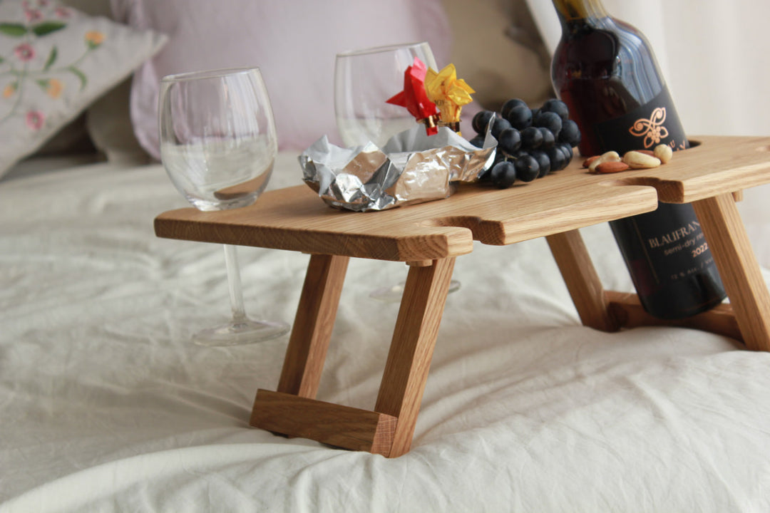 Outdoor-wine-table-with-slots-for-glasses-and-bottle