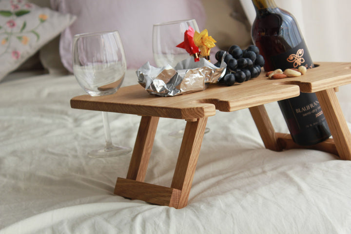 Outdoor-wine-table-with-slots-for-glasses-and-bottle