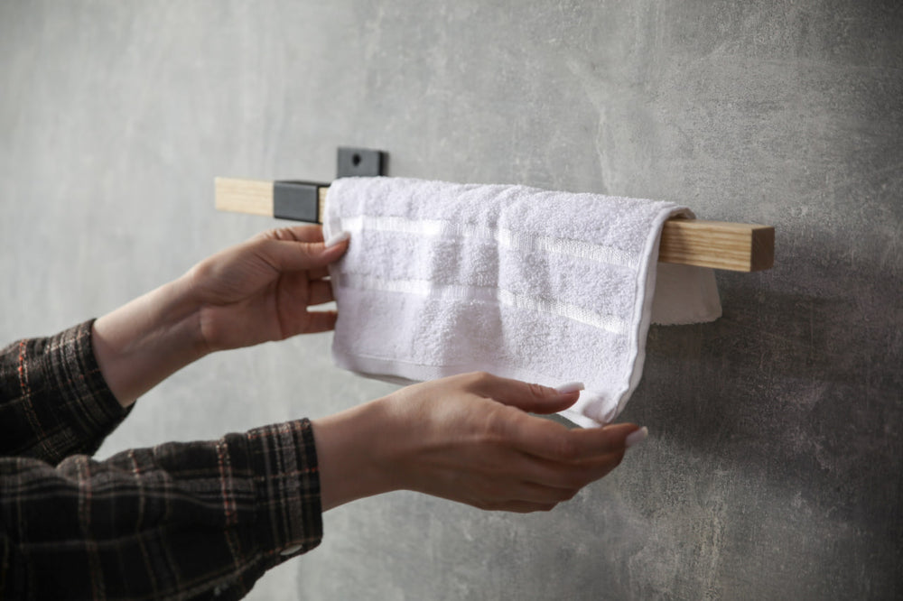 elegant-storage-solution-with-a-wooden-rail-perfect-for-towels