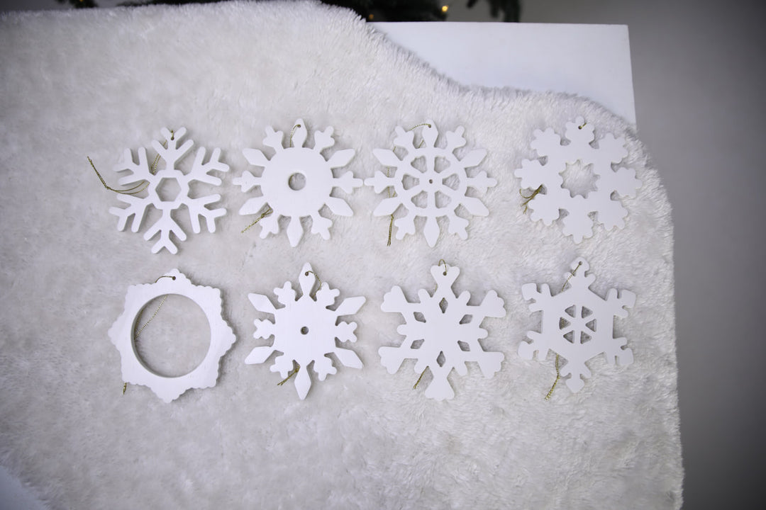 Hands-showing-white-plywood-snowflake-Christmas-decorations