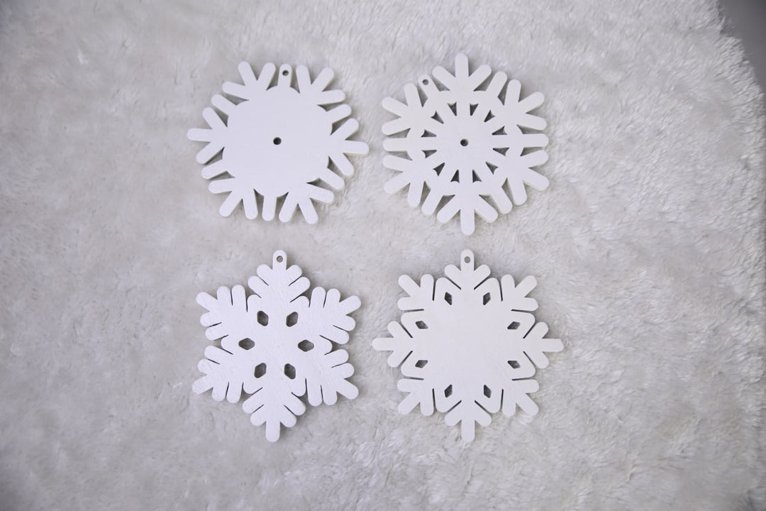 Hands-showing-white-plywood-snowflake-Christmas-decorations