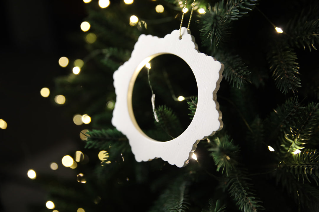 Hands-showing-white-plywood-snowflake-Christmas-decorations