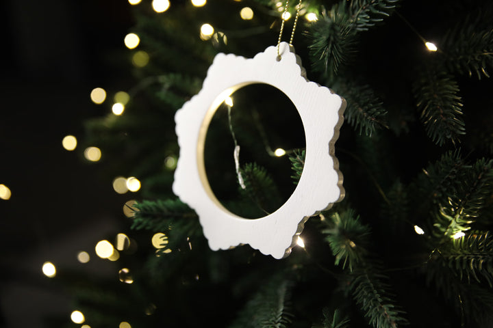 Hands-showing-white-plywood-snowflake-Christmas-decorations