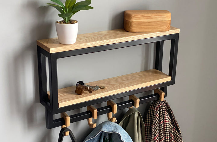 Space-saving-wall-mounted-hanger-with-shelf-and-multiple-hooks-for-coats