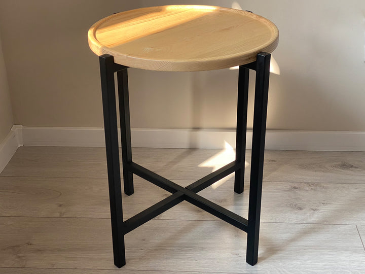 coffee-table with-a-natural-wood-top-and-black-metal-legs-perfect-for-modern-interiors