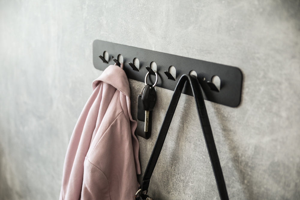 Minimalist-metal-key-hanger-with-sturdy-hooks-designed-for-keeping-keys-clothes