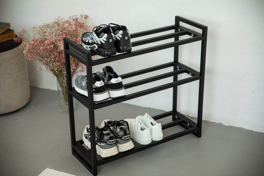 Metal-multi-tier-shoe-rack-with-sneakers-and-boots