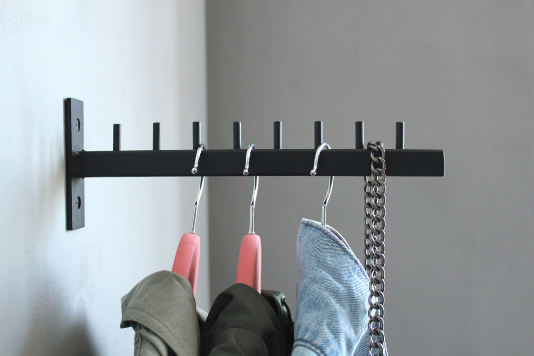Stylish-wall-mounted-coat-hanger-with-hooks-perfect-for-modern-home-decor