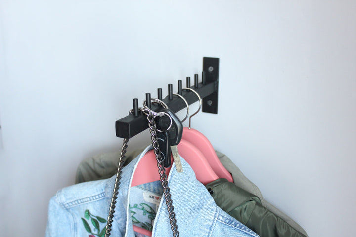 Stylish-wall-mounted-coat-hanger-with-hooks-perfect-for-modern-home-decor