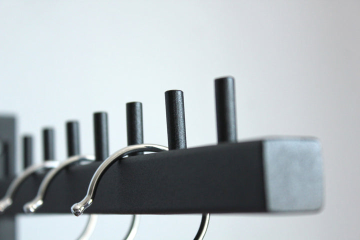 Stylish-wall-mounted-coat-hanger-with-hooks-perfect-for-modern-home-decor