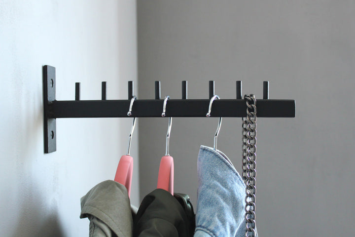 Stylish-wall-mounted-coat-hanger-with-hooks-perfect-for-modern-home-decor