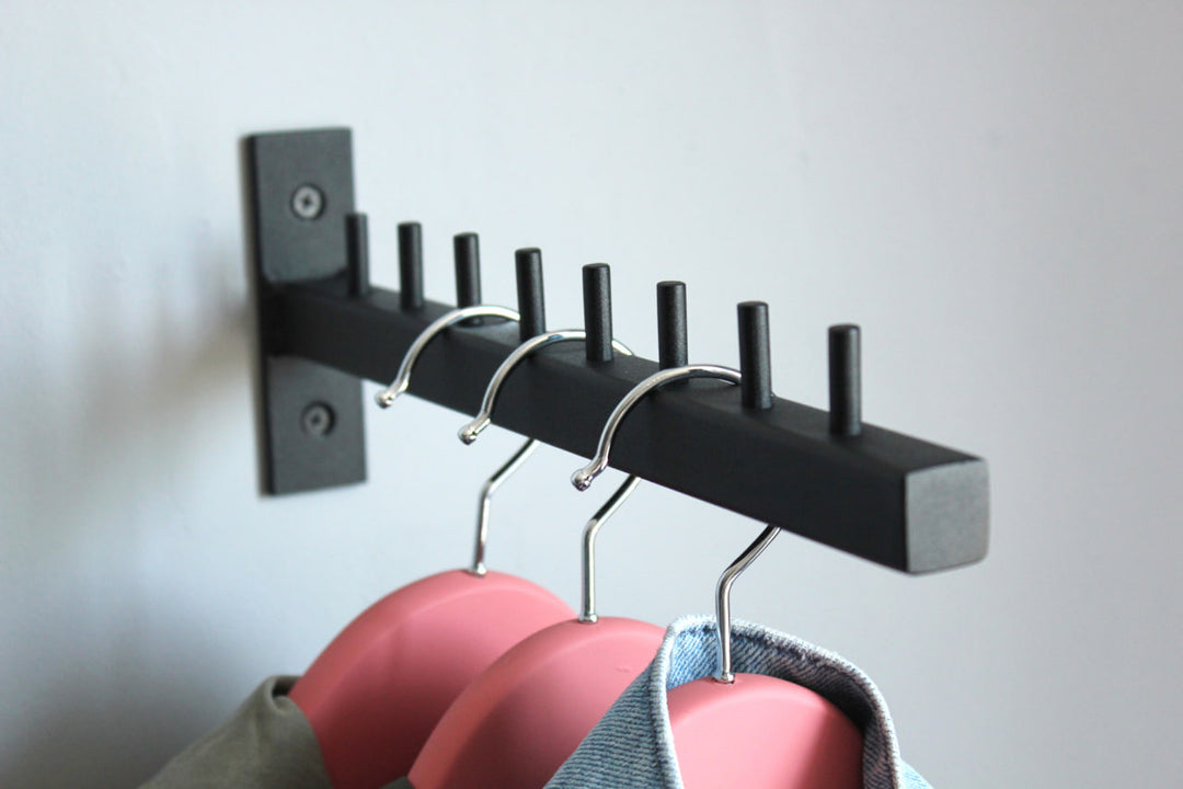 Stylish-wall-mounted-coat-hanger-with-hooks-perfect-for-modern-home-decor