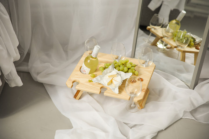 Outdoor-wine-table-with-slots-for-glasses-and-bottle
