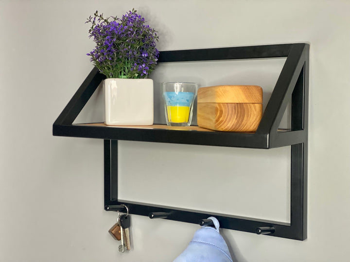 Contemporary-wall-mounted-clothes-hanger-with-a-practical-design