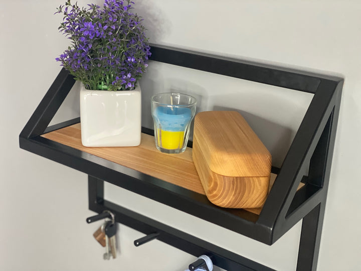 Contemporary-wall-mounted-clothes-hanger-with-a-practical-design